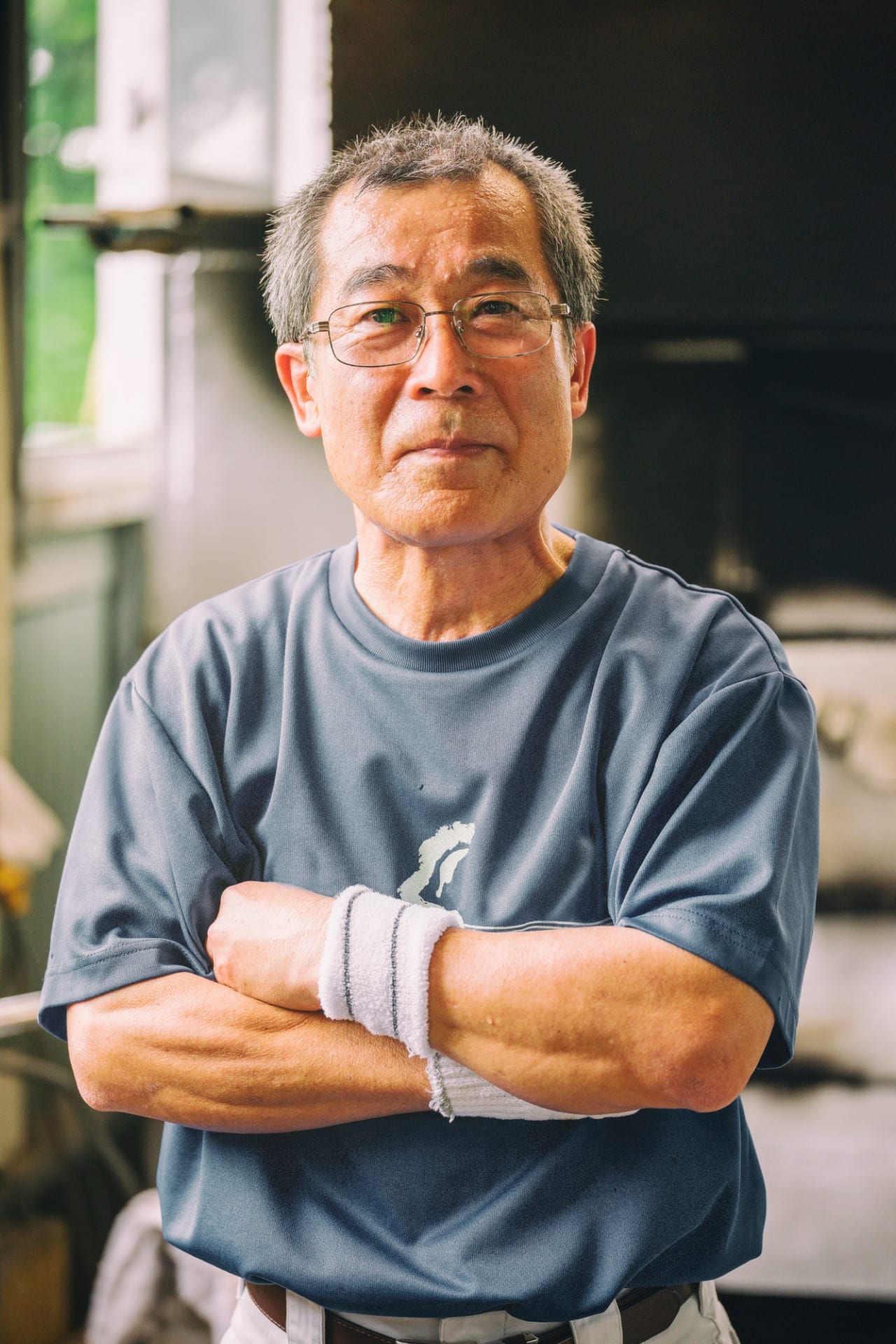 japanese man in glass blowing factory blue zone okinawa